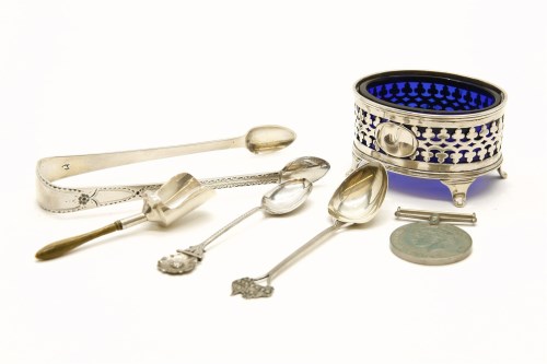 Lot 144 - A hallmarked silver salt with blue glass liner