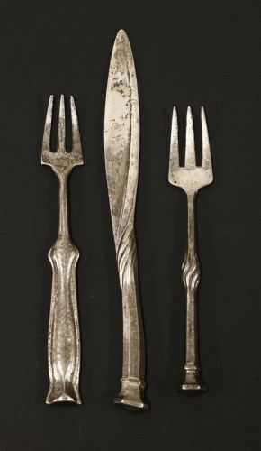 Lot 7 - An Arts & Crafts silver butter knife and matching pickle fork