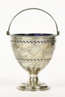 Lot 174 - A George III silver swing-handled sugar basket