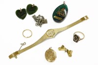 Lot 109 - A collection of items to include a gold memorial ring