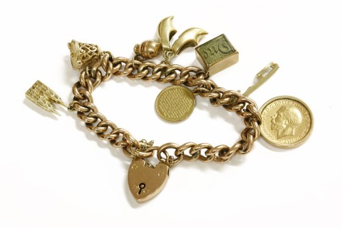 Lot 34 - A gold curb link bracelet with 9ct gold padlock