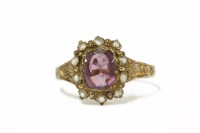 Lot 16 - A 15ct gold purple paste and seed pearl cluster ring