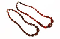 Lot 90 - A single row graduated cherry coloured olive shaped Bakelite bead necklace