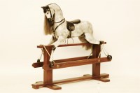 Lot 604 - A modern carved wooden rocking horse