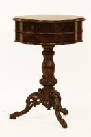Lot 629 - A 19th century Continental burr walnut shaped circular sewing table