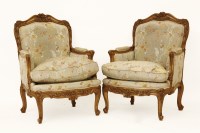 Lot 503 - A pair of large modern French carved walnut armchairs. 71 x 74 x 112cm high