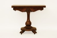 Lot 560 - A Victorian walnut card table