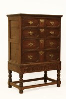 Lot 524 - A reproduction oak chest of four drawers on stand. 91 x 53 x 136cm high