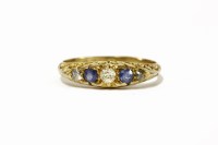 Lot 37 - A 18ct gold five stone graduated sapphire and diamond boat shaped ring