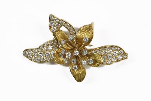 Lot 1 - A French diamond set gold and platinum orchid brooch