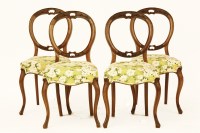Lot 704 - A set of four Victorian walnut balloon back chairs