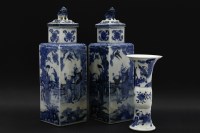 Lot 328 - A pair of Chinese square section blue and white porcelain vases and covers