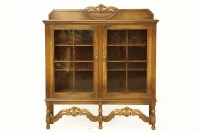 Lot 579 - An oak bookcase with two glazed doors