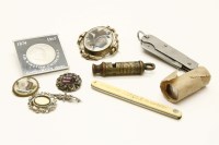 Lot 106 - An assortment of items to include a Metropolitan police whistle