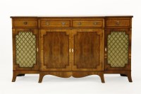 Lot 673 - A yew wood inlaid breakfront side cabinet