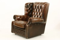 Lot 648 - A button back leather armchair