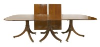 Lot 579 - A strung mahogany three-pillar dining table