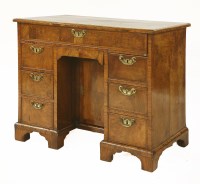 Lot 597 - A George II walnut kneehole desk