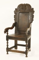 Lot 548 - An oak wainscot armchair