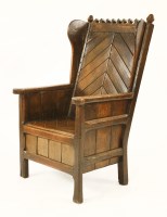 Lot 550 - An oak armchair