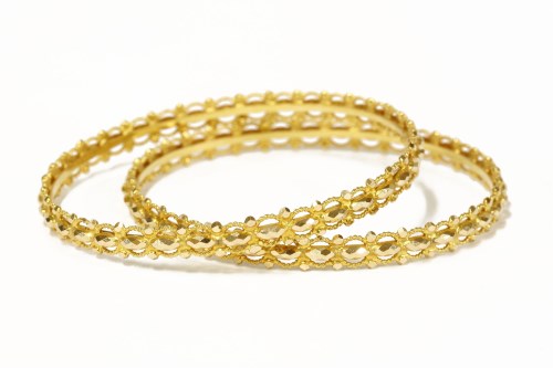 Lot 54 - A pair of Indian high carat gold bangles