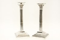 Lot 177 - A pair of plated columnar candlesticks