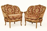Lot 624 - A pair of Epstein carved walnut fauteuils