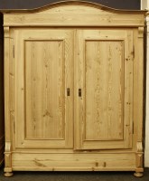 Lot 545 - A stripped pine armoire