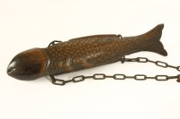 Lot 209 - A Japanese carved wooden fish kettle hook