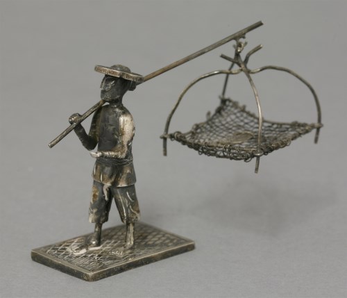 Lot 64 - A silver Fish Seller