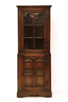 Lot 464 - A reproduction oak standing corner cupboard
