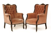 Lot 470 - A pair of late Victorian ebonised armchairs
