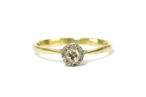 Lot 5 - A gold single stone illusion set diamond ring