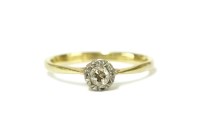 Lot 5 - A gold single stone illusion set diamond ring