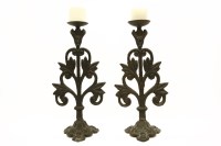 Lot 187 - A pair of cast iron pricket candlesticks