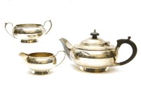 Lot 112 - A silver three piece tea set