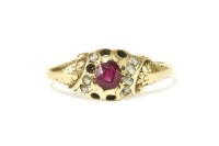 Lot 10 - A gold oval cut ruby and rose cut diamond cluster ring