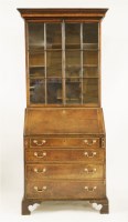 Lot 410 - A George III mahogany bureau bookcase