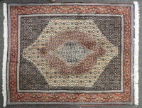 Lot 479 - A circular Persian rug