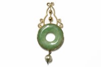 Lot 5 - A gold jadeite circular bi-pendant