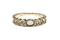 Lot 14 - An opal cabochon and diamond half hoop ring