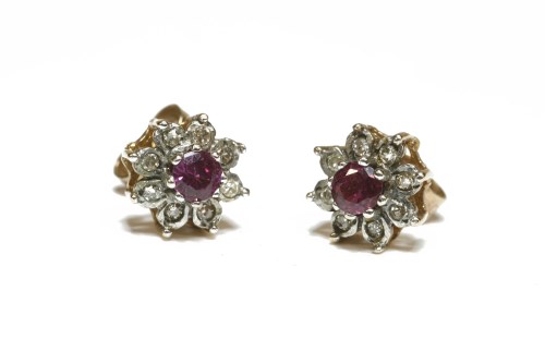 Lot 25 - A pair of 9ct gold circular cut ruby and diamond cluster earrings