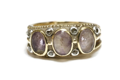 Lot 49 - A gold three stone amethyst ring