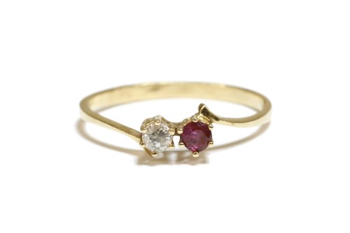 Lot 33 - A Continental gold two stone ruby and cubic zirconia crossover ring