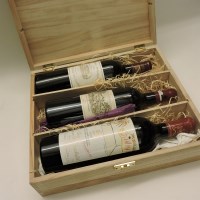 Lot 328 - A 2006 three bottle wooden presentation case containing one bottle each: Château Margaux