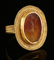 Lot 20 - A high carat gold cornelian intaglio ring