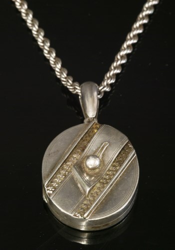 Lot 49 - A late Victorian silver hinged locket and chain
