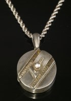 Lot 49 - A late Victorian silver hinged locket and chain
