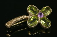 Lot 717 - A 9ct gold amethyst and peridot cinquefoil cluster flower brooch
