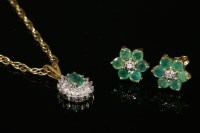 Lot 722 - A pair of diamond and emerald daisy cluster stud earrings
